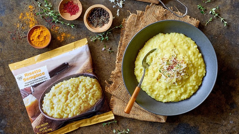 Trader Joe's Risotto Semplice in a bag next to a prepared bowl on a table