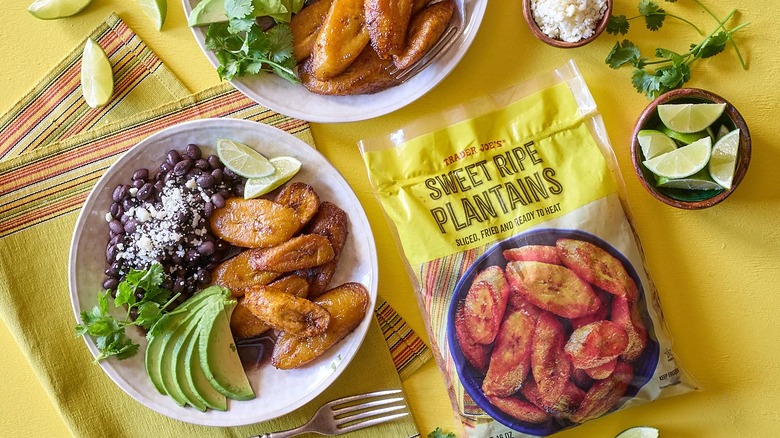 A bag of Trader Joe's Sweet Ripe Plantains on a table next to two prepared plates
