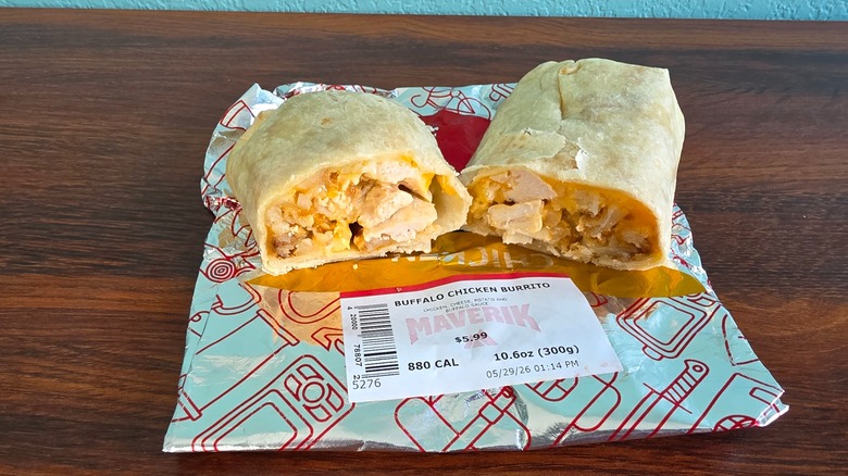 Halved buffalo chicken burrito on wrapper