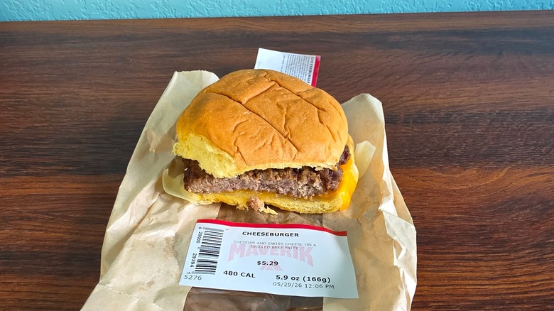 Cheeseburger on wrapper with part cut off front
