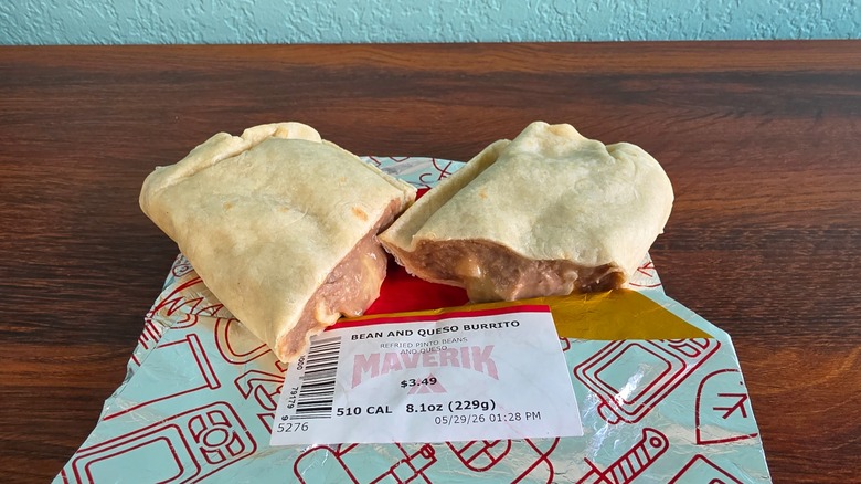 Halved bean and queso burrito on wrapper