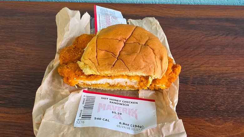 Hot honey chicken sandwich on wrapper with front cut