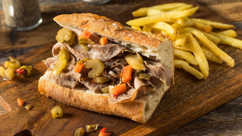 Italian beef sandwich and fries on cutting board