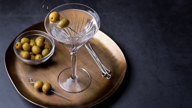 martini with olives on tray