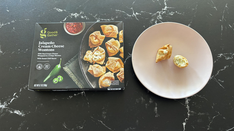 Good & Gather jalapeño cream cheese wontons box next to wontons on plate