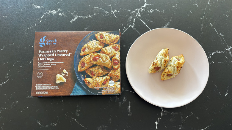 Good & Gather Parmesan pastry hot dogs box next to pastry hot dogs on plate