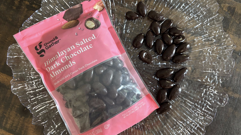 Good & Gather Himalayan salted dark chocolate almonds in bag and scattered on clear platter