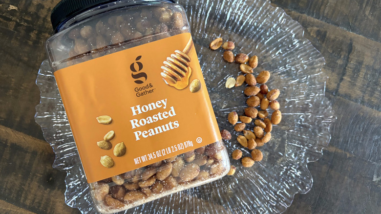 Good & Gather honey roasted peanuts in jar and scattered on clear platter