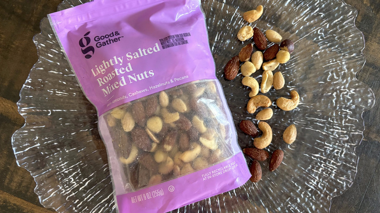 Good & Gather lightly salted roasted mixed nuts in bag and scattered on clear platter