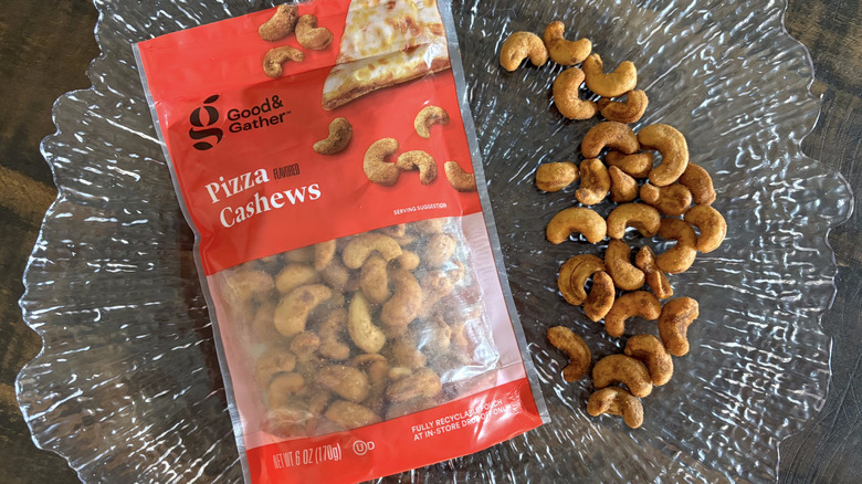 Good & Gather pizza flavored cashews in bag and scattered on clear platter