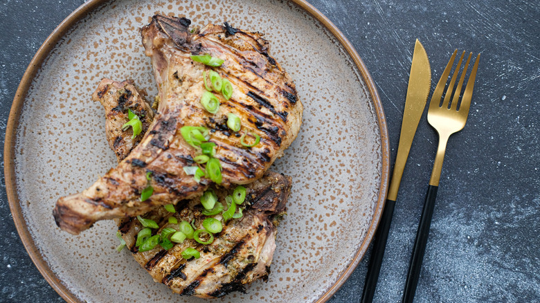 Grilled pork chops on plate