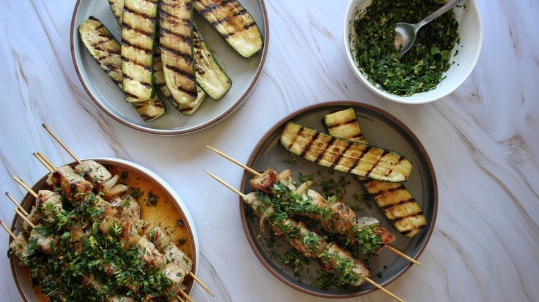 Grilled pork skewers with grilled zucchini slices