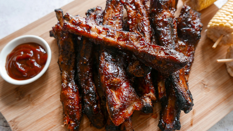 Spare ribs on wooden board