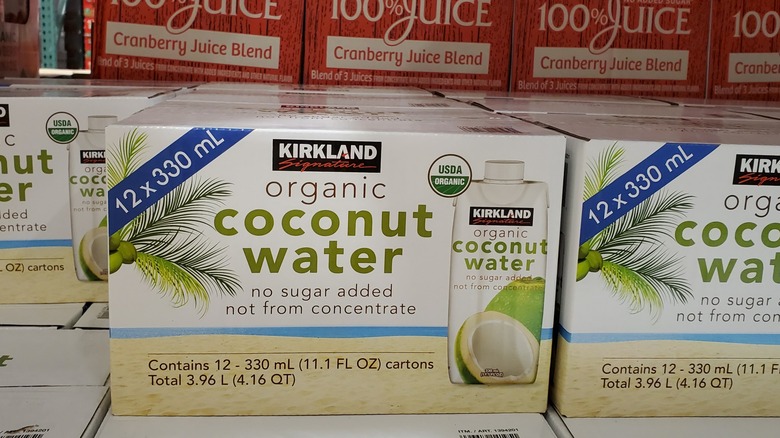 Cases of Kirkland Signature organic coconut water at Costco