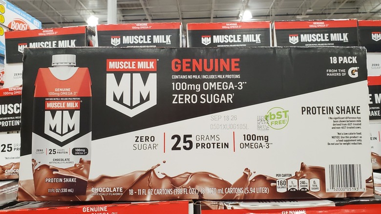 Muscle Milk chocolate protein shakes on a shelf at Costco