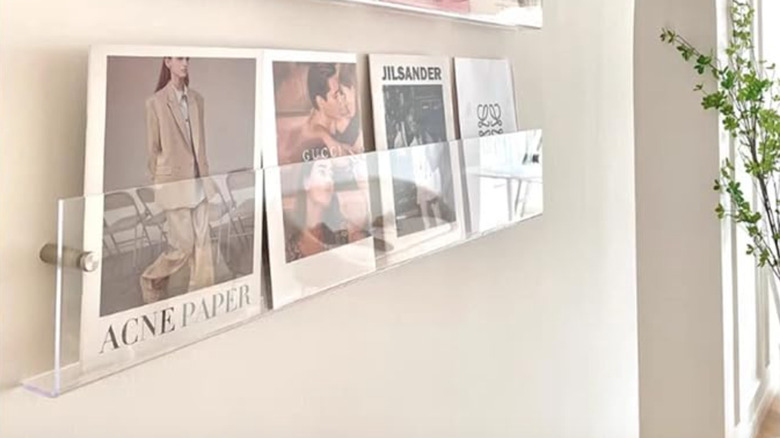 Hanging acrylic magazine holder for cookbooks.