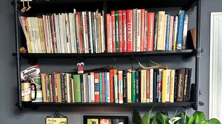 Cookbooks on open shelving unit.