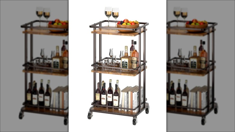 Kitchen bar cart with cookbooks on it.