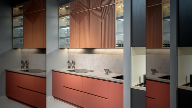 Coral pink lower cabinets and upper cabinets with paneled design