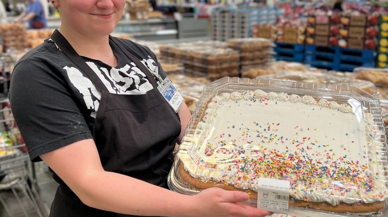 Sam's Club baker holding sweet celebration half sheet cookie cake