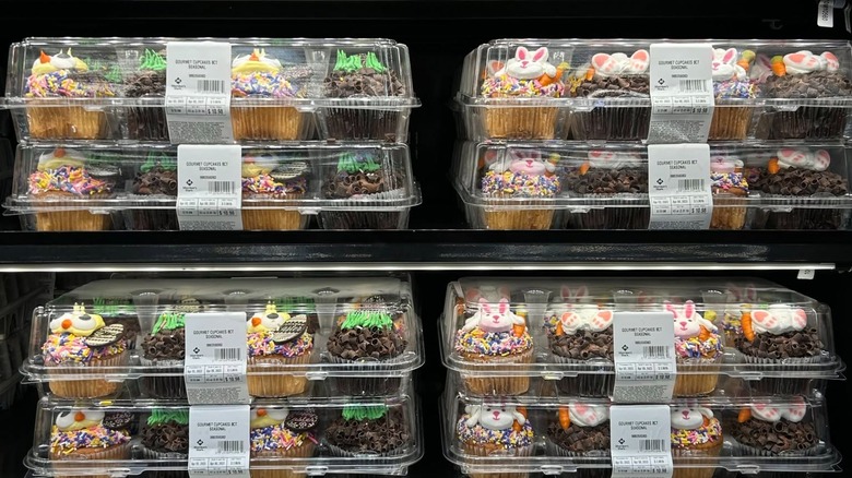 Various packages of white and chocolate cupcakes decorated for Easter