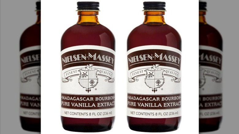 Two brown glass bottles of Nielsen-Massey vanilla extract