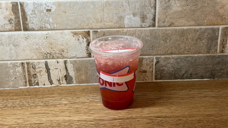 Sonic drink made with Sprite, sweet cream, strawberry pieces, coconut flavor