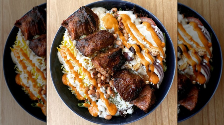 Saffron steak with beans in bowl at Chortke