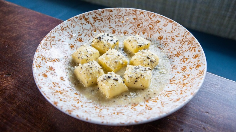 Ricotta dumplings on plate at Alla Vita