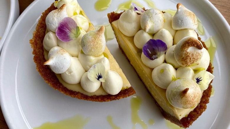 Split Key lime pie on white plate at Modern Bird