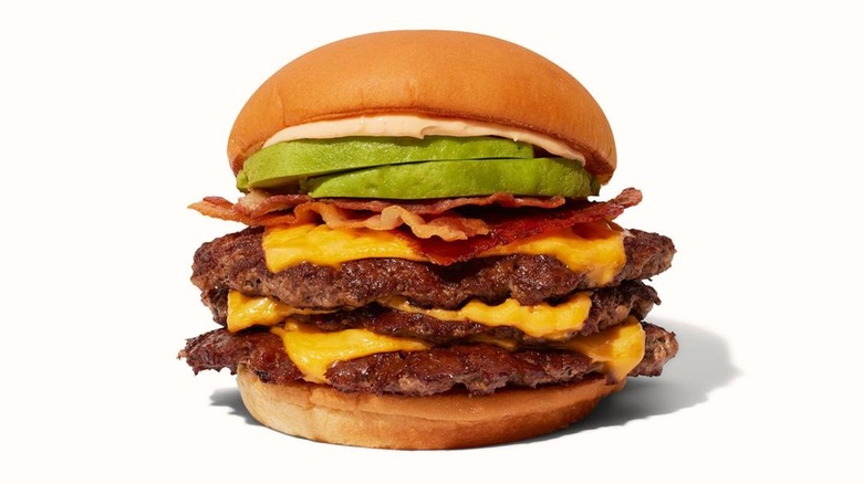 Shake Shack Triple Avocado Bacon Burger on a white background