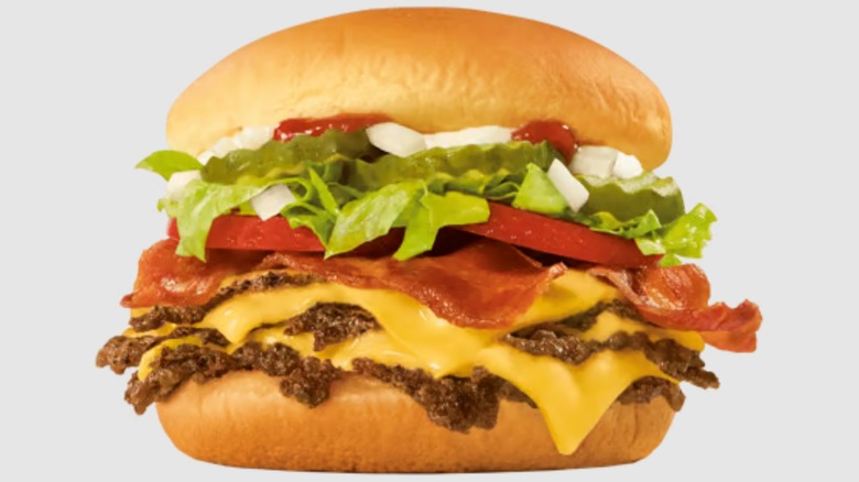 Sonic All-American Bacon Triple Sonic Smasher burger on a neutral background