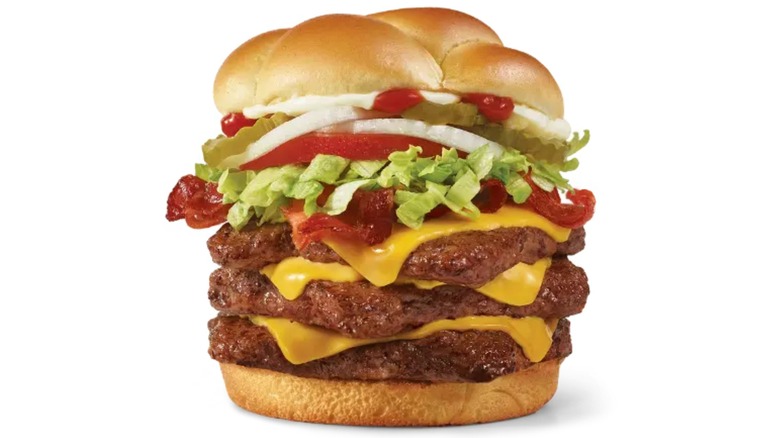 A beauty shot of the Wendy's Big Bacon Classic Triple cheeseburger on a white background