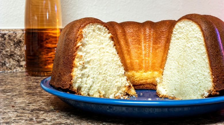 A closeup of a 7Up pound cake with a slice cut out