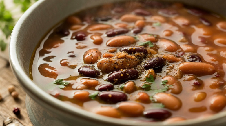 A colesup of a mixed bean dish