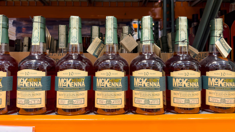 A line of Henry McKenna bottles shown on a store shelf