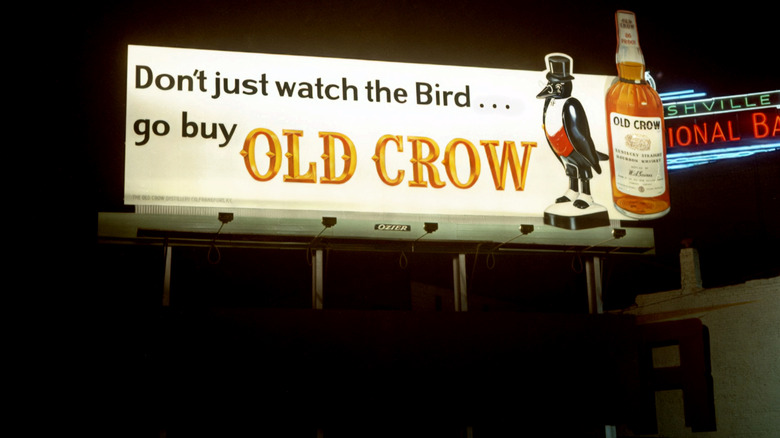 A vintage billboard showing an advertisement for Old Crow bourbon
