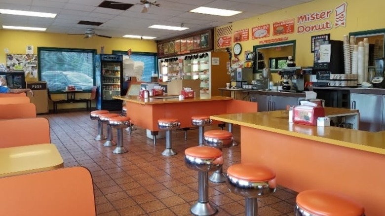 Yellow and orange retro interior of the last Mister Donut