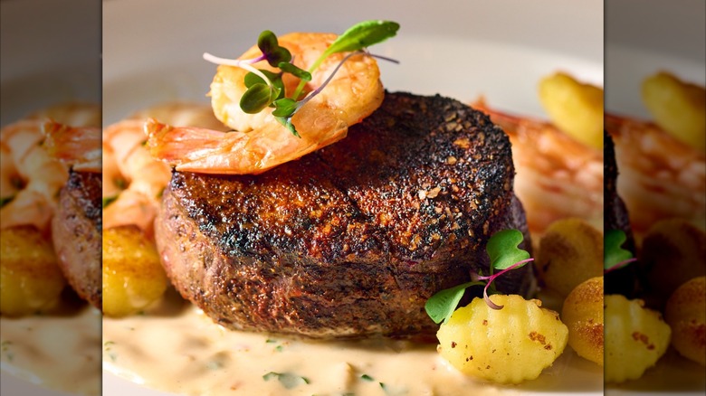 Filet and shrimp on plate