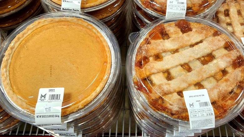 Sam's Club brand Member's Mark apple and pumpkin pies displayed in rows inside store