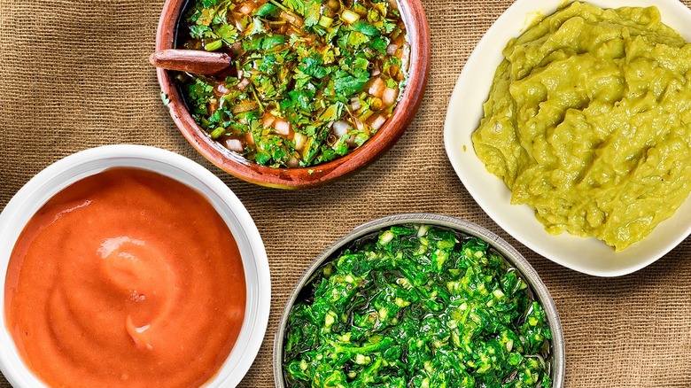 Green, yellow, and orange sauces
