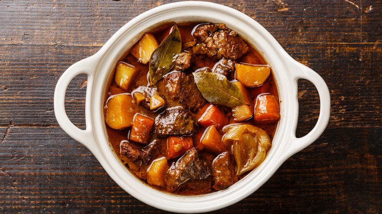 Beef stew on wooden table