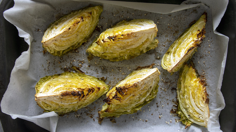 Roasted cabbage wedges on baking sheet