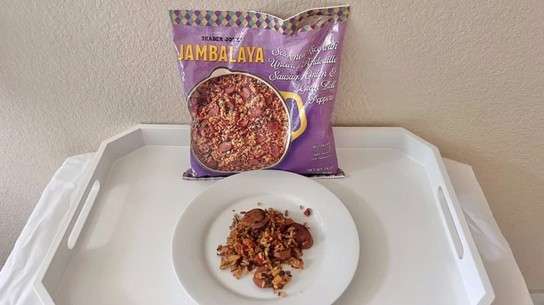 Bag of Trader Joe's Jambalaya behind white plate with jambalaya