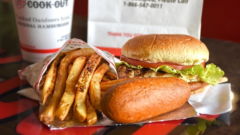 Cook Out grilled chicken sandwich with fries, corn dog, and drink