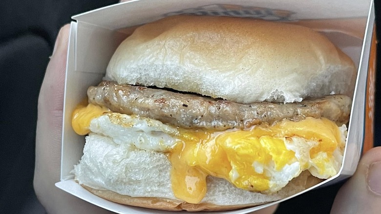 Box containing a White Castle sausage, egg, and cheese breakfast slider