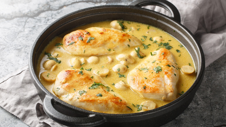 Chicken and mushroom in a creamy lemon sauce served in a black bowl