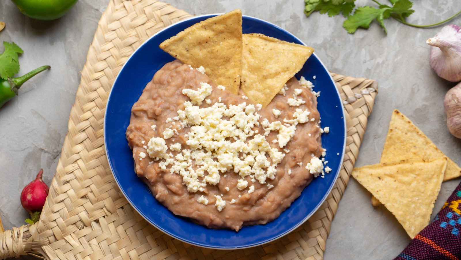 14 Ways To Add Flavor To Canned Refried Beans