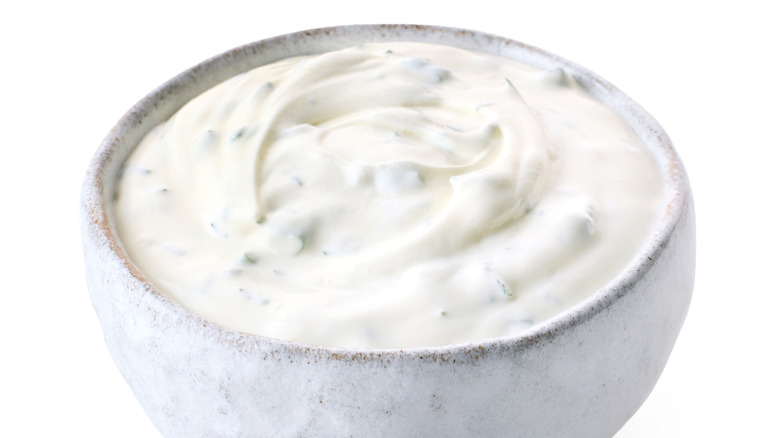 Creamy herb dip in grey bowl
