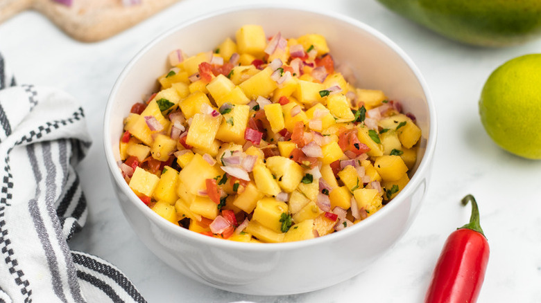 Mango salsa in white bowl